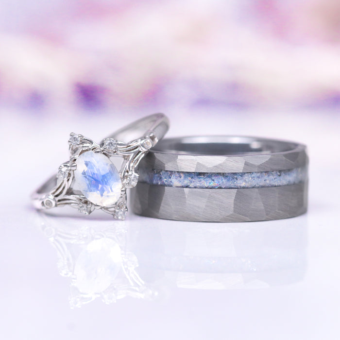 Crushed Moonstone men's tungsten wedding band shown beside the Maeve vintage moonstone engagement ring as a matching couples set by Aquamarise