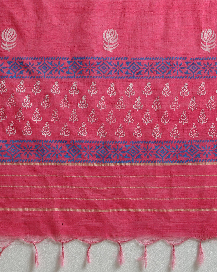 Magenta katan silk unstitched suit set with small white floral hand block print, a solid magenta piece, and a dupatta with wide blue geometric border and metallic-toned edge.