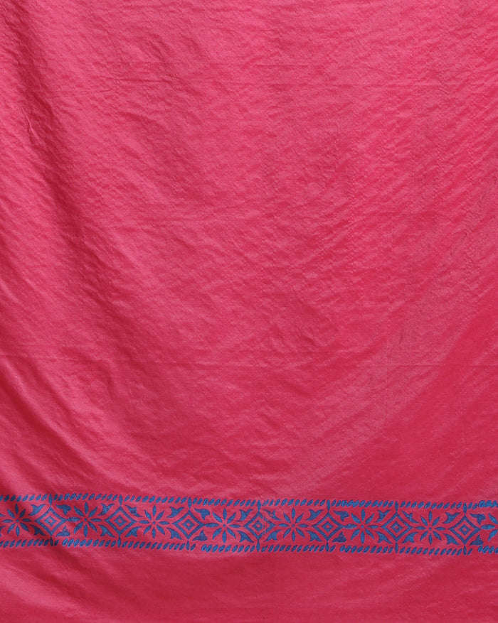 Magenta katan silk unstitched suit set with small white floral hand block print, a solid magenta piece, and a dupatta with wide blue geometric border and metallic-toned edge.