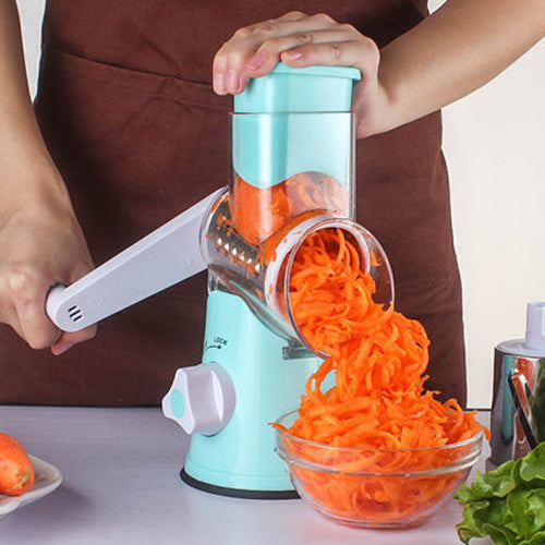 Manual kitchen accessories multifunctional mandoline vegetable slicer in use for shredding carrots.