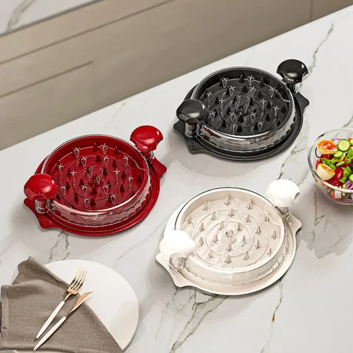 Manual meat shredder for chicken and beef in red, black, and white colors on a kitchen countertop.