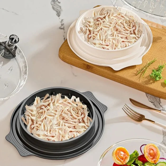 Manual meat shredder for chicken and beef with shredded meat in bowls on a kitchen countertop.