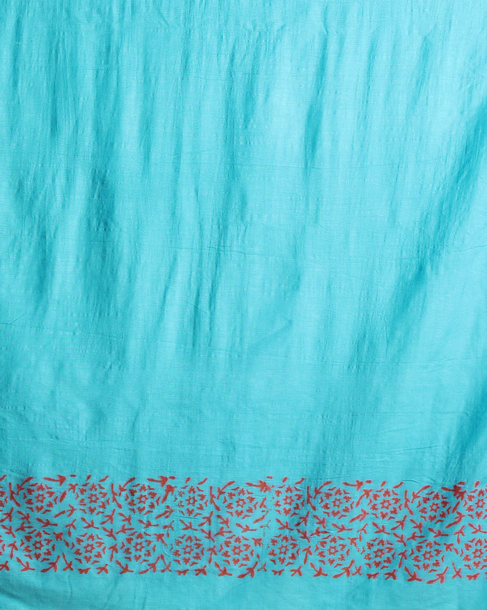 Maroon katan silk unstitched suit set hand block printed with small turquoise botanical motifs and angular geometric key-pattern bands at the ends.