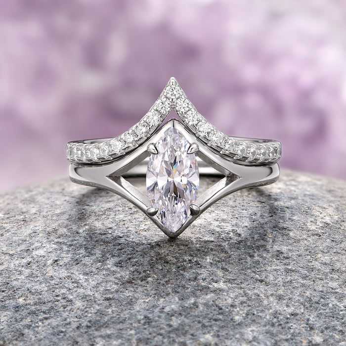 Marquise Cut Simulated Diamond Couples Ring Set by Aquamarise, featuring a sleek silver band with a marquise-shaped simulated diamond centerpiece accented by delicate pavé-set smaller stones, ideal for modern matching couples rings.