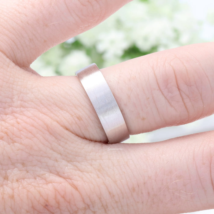 Marquise Cut Simulated Diamond Couples Ring Set by Aquamarise showcases a minimalist matte silver band worn on a finger, reflecting a sleek and modern style from Matching Couples' Rings and Minimalist Jewelry collections.
