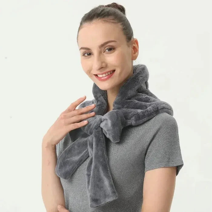 Microwave heating pad wrap in gray fleece, worn around the shoulders for soothing warmth and comfort.