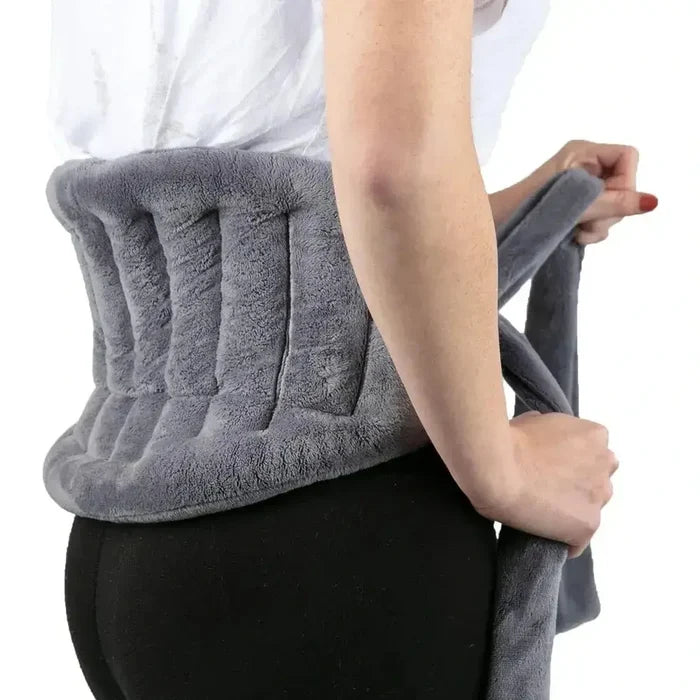 Woman wearing a microwave heating pad wrap made of soft fleece for neck and back comfort.