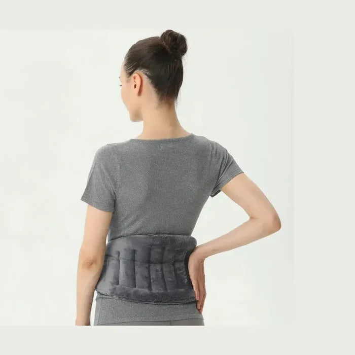 Model wearing a microwave heating pad wrap around the back for soothing warmth and comfort.