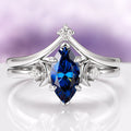 Midnight Blue Moissanite Crescent Moon Engagement Ring Set in 14K White Gold by Aquamarise Gold, featuring a marquise-cut deep blue moissanite center stone accented with crescent-shaped details and small sparkling diamonds, part of Solid Gold Engagement Rings, Moissanite Engagement Rings, and Meaningful Jewelry Gifts collections.