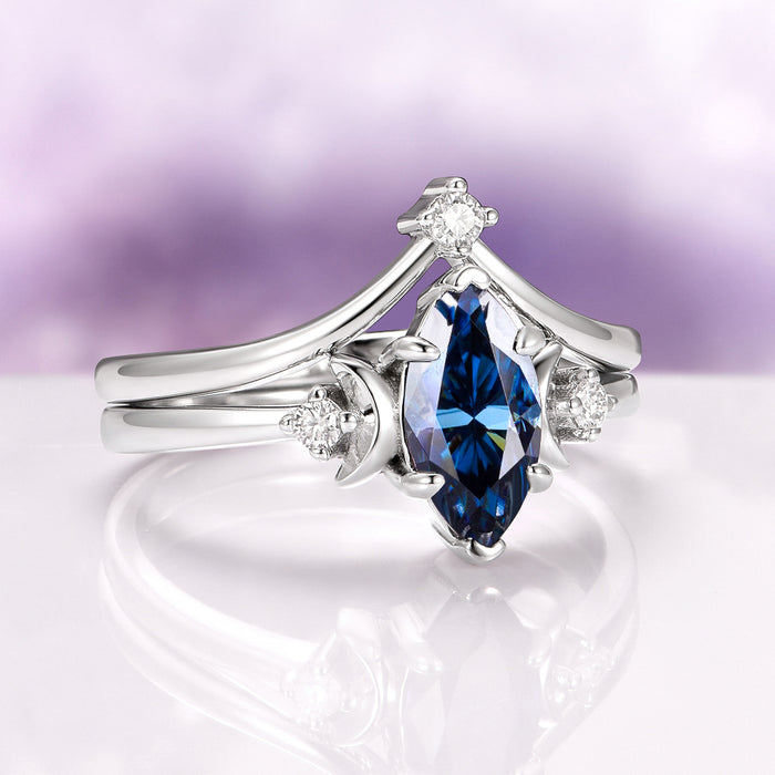 Midnight Blue Moissanite Crescent Moon Engagement Ring Set in 14K White Gold featuring a marquise-cut deep blue moissanite center flanked by delicate crescent moon and small diamond accents, by Aquamarise Gold, part of Solid Gold Engagement Rings and Moissanite Engagement Rings collections.
