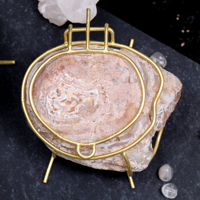 Natural geode ring box by Aquamarise shown closed, with raw stone exterior and polished gold hinge