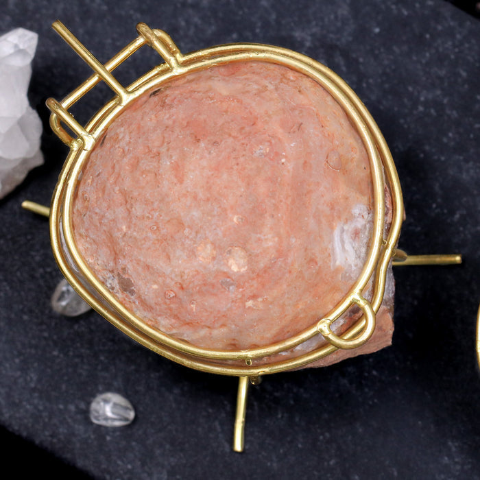 Rose Blush Pink geode ring box by Aquamarise shown closed with natural stone exterior and gold hinge