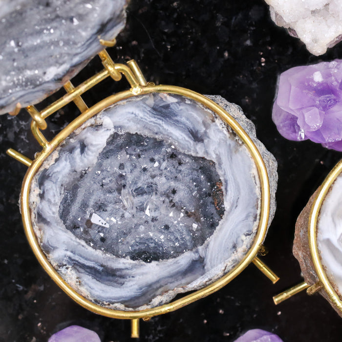 Grey crystal geode ring box by Aquamarise, opened to show the sparkling crystal interior and ring slot