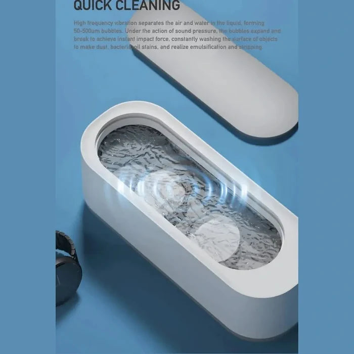 Mini Ultrasonic Jewelry Cleaner device held in hand to show compact size