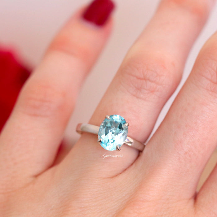 Minimalist Aquamarine Ring in Sterling Silver featuring an oval lab-created aquamarine set on a sleek sterling silver band by Aquamarise, perfect for timeless elegance.