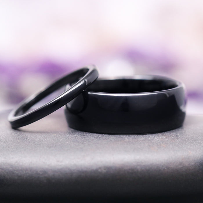 Minimalist Black Tungsten Couples Ring Set by Aquamarise showcasing a pair of sleek, polished black tungsten carbide bands in 8mm and 2mm widths, from Matching Couples' Rings, Black Finish Rings, and Meaningful Jewelry Gifts collections.