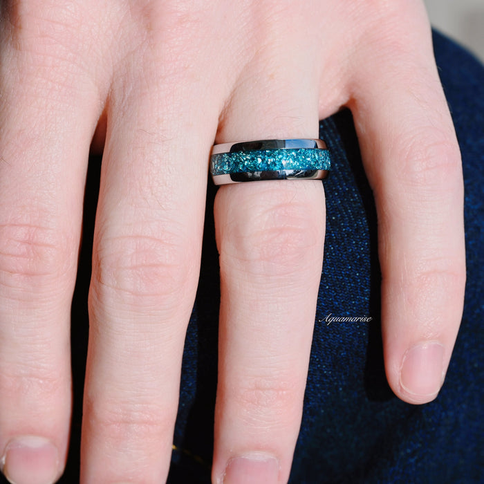 Minimalist Crushed Aquamarine Couples Ring Set by Aquamarise featuring a vibrant aquamarine inlay on a polished silver band, worn on hand, symbolizing love and commitment.