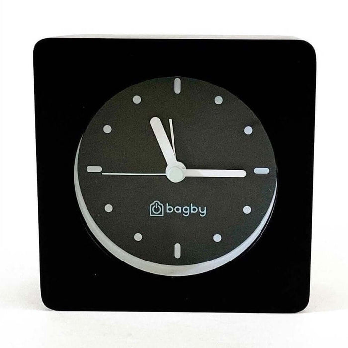 Minimalist silent alarm clock with black wooden frame and non-numbered dial from Bagby.