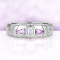 Men's 6mm sterling silver wedding band with a bezel-set oval moissanite between two natural amethyst pears and carved leaf shoulders