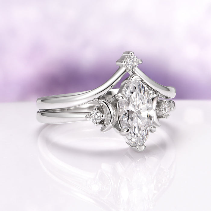 Moissanite & Crescent Moon Constellation Couples Ring Set featuring a marquise-cut moissanite centerpiece flanked by crescent moon and small round accents in polished sterling silver by Aquamarise, ideal for matching couples and symbolic jewelry gifts.