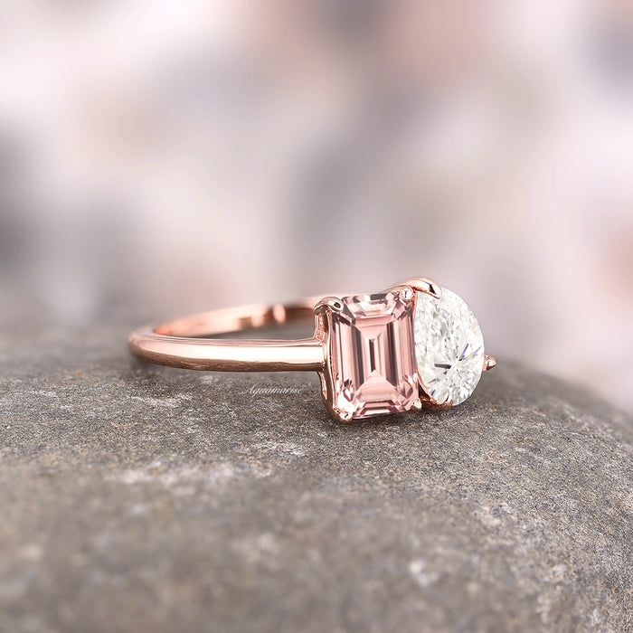 Toi Et Moi Morganite and Moissanite Ring- 14K Solid Rose Gold by Aquamarise Gold featuring an emerald-cut morganite and pear-shaped moissanite on a delicate rose gold band resting on stone surface.