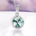 Moss Agate Crescent Moon Necklace in Sterling Silver by Aquamarise, featuring a polished crescent moon design embracing a round, faceted natural moss agate gemstone, part of Moss Agate Jewelry, Necklaces, and Meaningful Jewelry Gifts collections.