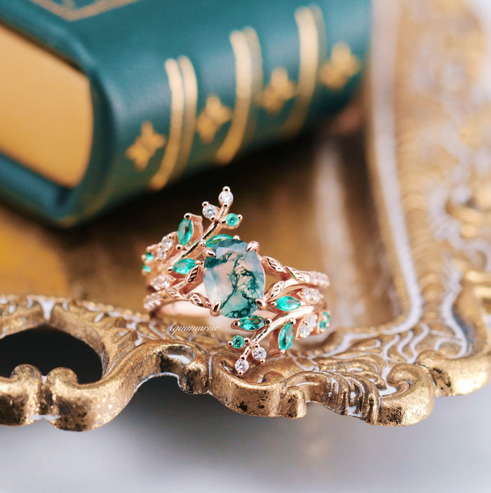 Emerald Leaf Ring Guard in 14K Solid Rose Gold by Aquamarise Gold, featuring a nature-inspired design with vibrant green stones and delicate leaf and vine details for elegant layering.