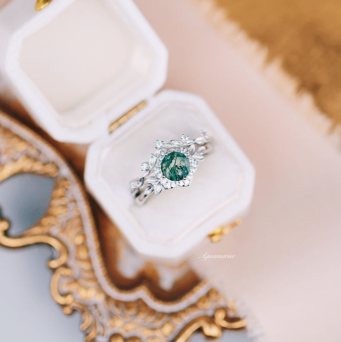 Moss Agate Fairy Leaf Ring Set in 14K White Gold by Aquamarise Gold featuring a green moss agate stone with delicate leaf and floral motifs in a nature-inspired engagement ring design.