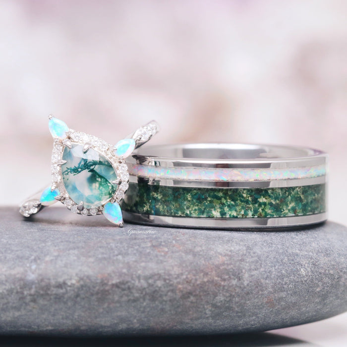 Green Moss Agate & Fire Opal Couples Ring Set featuring a sterling silver ring with a pear-shaped moss agate center surrounded by fire opal accents and a matching band inlaid with green moss agate and opal, crafted by Aquamarise.