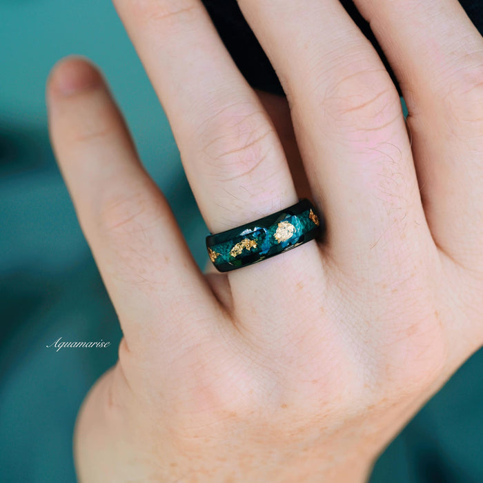 Green Moss Agate & Gold Leaf Couples Ring Set featuring a polished black band with embedded green moss agate and gold leaf accents, designed by Aquamarise as part of nature-inspired matching couples' rings collections.