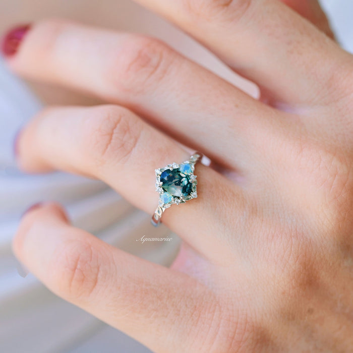 Moss Agate & Opalescent Sapphire Engagement Ring in 14K White Gold by Aquamarise Gold showcasing a deep green moss agate center with sapphire and diamond accents on a finely detailed band.
