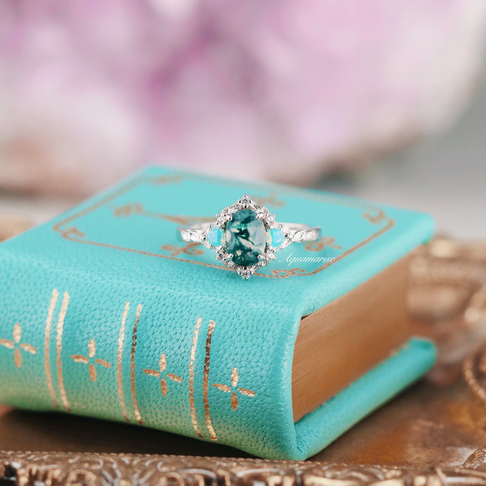 Moss Agate & Opalescent Sapphire Engagement Ring in 14K White Gold featuring a green moss agate center with opalescent sapphire accents on a nature-inspired band by Aquamarise Gold.