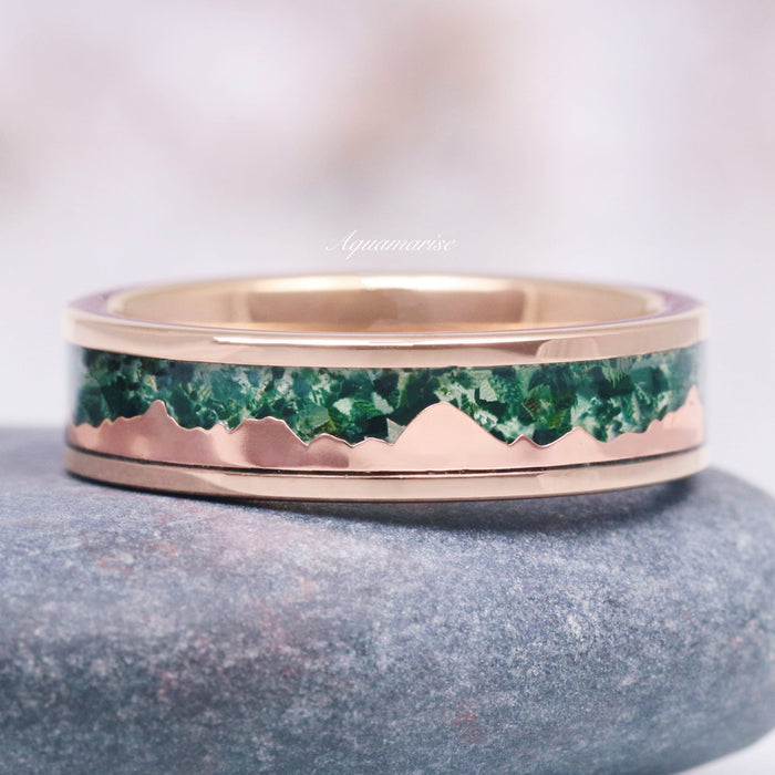 Mountain Range Moss Agate Wedding Band in Rose Gold Tungsten Carbide (6mm) by Aquamarise featuring a polished rose gold band with a textured green moss agate inlay shaped like rugged mountain peaks, part of Men’s and Women’s Wedding Bands collections.