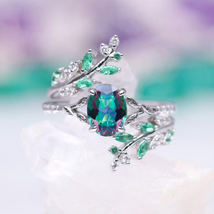 Oval Cut Mystic Topaz Engagement Ring in 14K White Gold by Aquamarise Gold, featuring nature-inspired leaf design with green accents in a fantasy-inspired solid gold engagement ring.