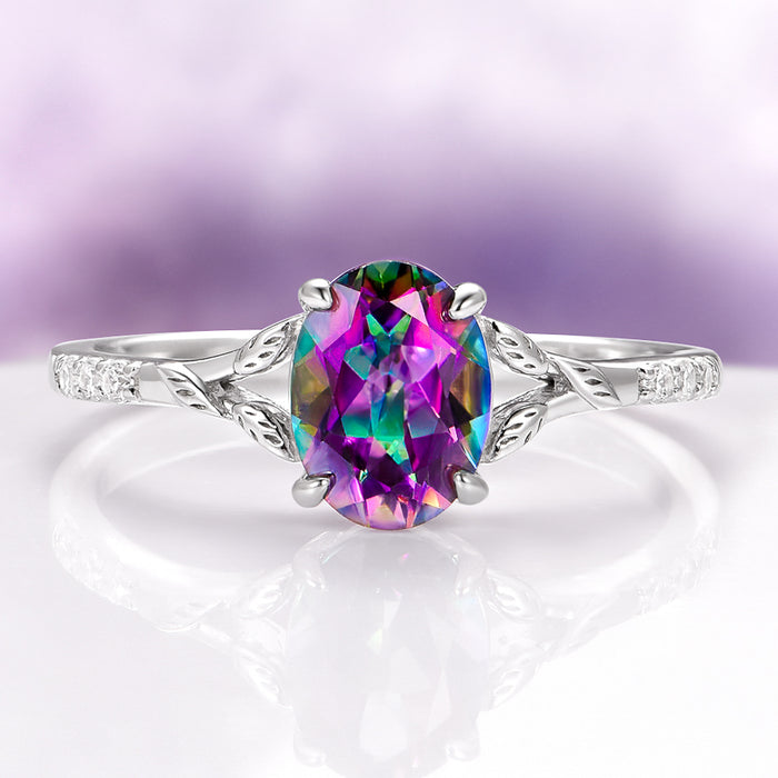 Mystic Topaz & Galaxy Opal Leaf Couples Ring Set by Aquamarise featuring a vibrant mystic topaz center stone with leaf-inspired silver band and accent diamonds.