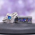 Two rings with gemstones on a dark surface and purple gradient background