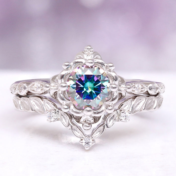 Silver ring with a colorful gemstone on a white background