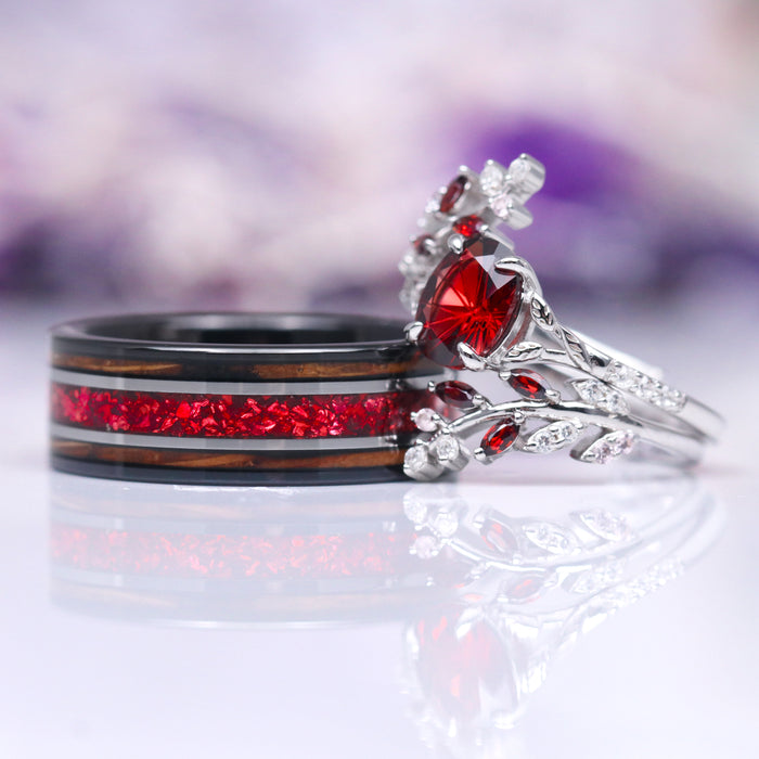 Fireworks Cut Natural Red Garnet Leaf Engagement Ring in 14K White Gold paired with a whiskey barrel wood inlay ring featuring vibrant red garnet accents, showcased by Aquamarise Gold from collections including Solid Gold Engagement Rings, January Birthstone Jewelry, and Nature-Inspired Engagement Rings.