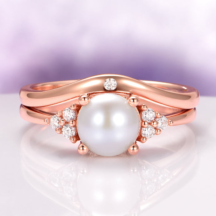Natural Freshwater Pearl Ring Set in 14K Rose Gold Vermeil by Aquamarise featuring a luminous pearl centerpiece with sparkling accents on a vintage-inspired rose gold vermeil band.