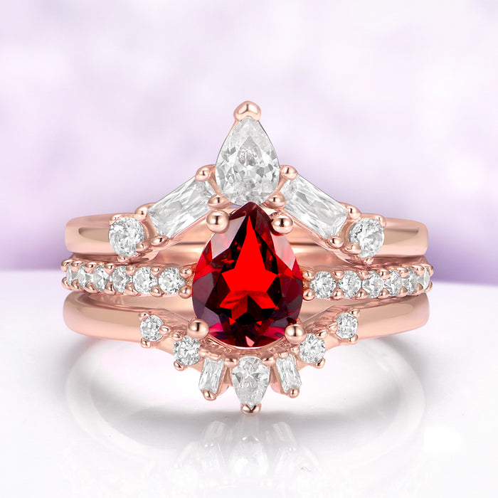 Natural Garnet 3pcs Ring Set in 14K Rose Gold Vermeil by Aquamarise, featuring a pear-cut red garnet with a diamond halo, a pave band, and a marquise crown band.