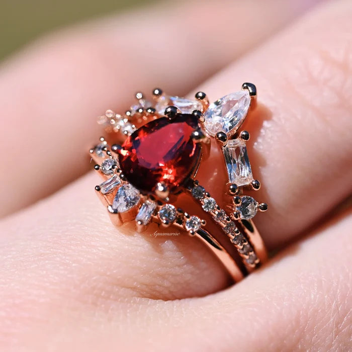 Natural Garnet 3pcs Ring Set- 14K Rose Gold Vermeil by Aquamarise, featuring a pear-shaped garnet centerpiece surrounded by sparkling accents on elegant rose gold vermeil bands.
