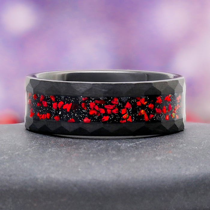 Galaxy Red Fire Opal Hammered Tungsten Couples Ring by Aquamarise, featuring crushed red fire opal inlay in a faceted black tungsten band, part of Matching Couples' Rings collection.