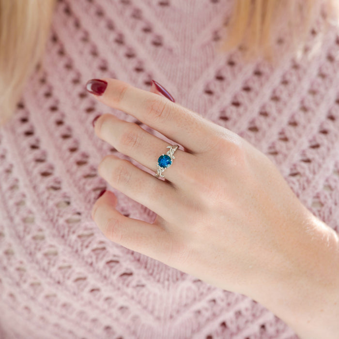 London Blue Topaz Leaf Ring- 14K White Gold by Aquamarise Gold featuring a rich blue topaz and delicate leaf and vine design, from nature-inspired and November Birthstone collections.