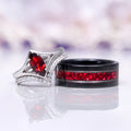 Natural Red Garnet Marquise Cut Engagement Ring Set in 14K White Gold featuring a marquise-cut red garnet centerpiece with a diamond-accented white gold band paired with a black band inlaid with red garnet fragments by Aquamarise Gold.