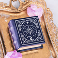 Night Court Handmade Leather Book Ring Box (Small) by Aquamarise with celestial design, placed on ornate gold tray with pink crystal accents, from Ring Boxes & Keepsake Proposals collection.