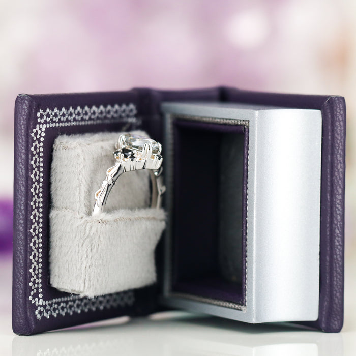 Night Court Handmade Leather Book Ring Box (Small) by Aquamarise, dark purple handcrafted box with plush interior holding a silver fantasy-inspired engagement ring inside.