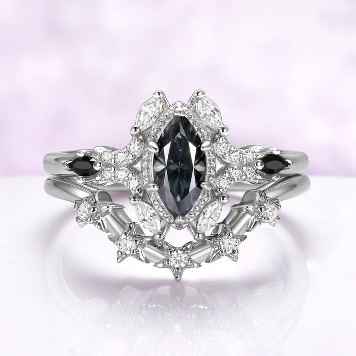 Gray moissanite and black onyx bridal ring set in sterling silver, all three rings stacked