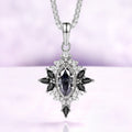 Nightbriar dark gray moissanite pendant necklace in sterling silver with natural black onyx marquise rays on a box chain