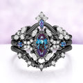 Lab-grown alexandrite bridal ring set in black ruthenium, all three rings stacked