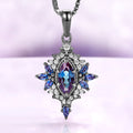 Nightbriar lab-grown alexandrite pendant necklace in black ruthenium, marquise center stone in a milgrain starburst frame on a box chain